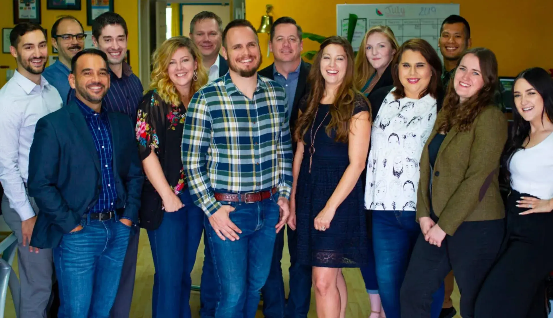The Anchor Wave team standing together in their office